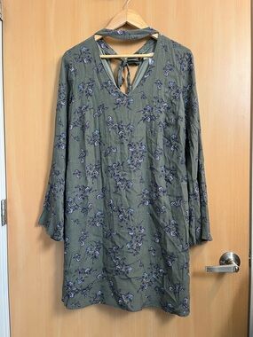 Long sleeve a-line dress with v neckline tie detail and bell sleeves